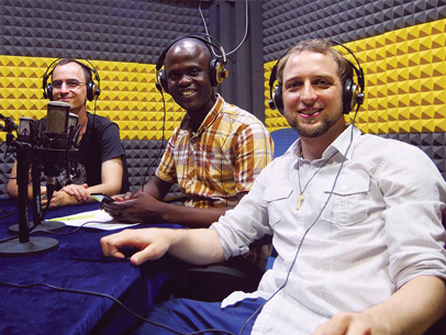 Three men in audio studio