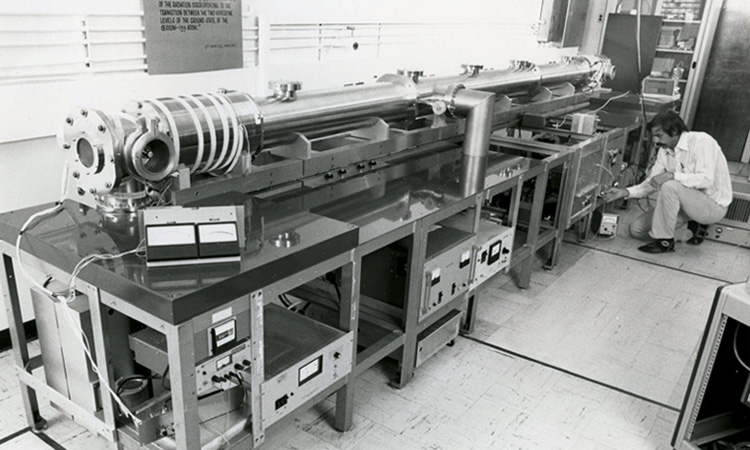 Researcher sitting in a lab writing