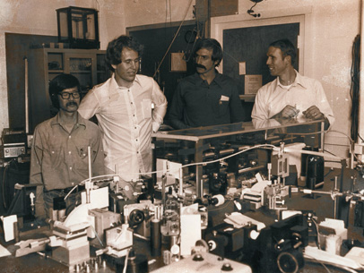 Researcher sitting in a lab writing