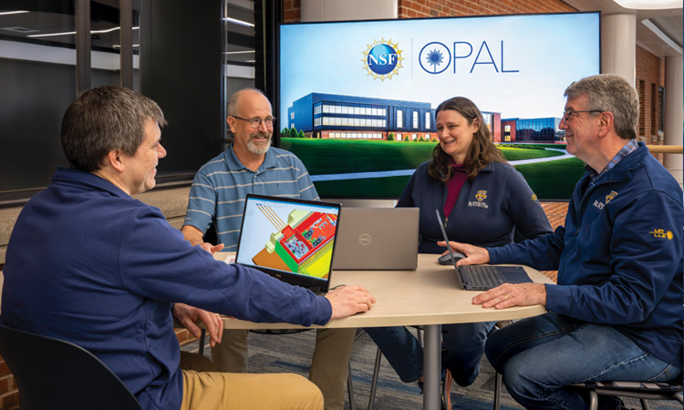 People at table with computers