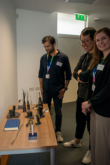 Conference attendees looking at exhibit