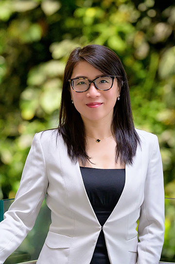 Headshot of Asian woman in glasses