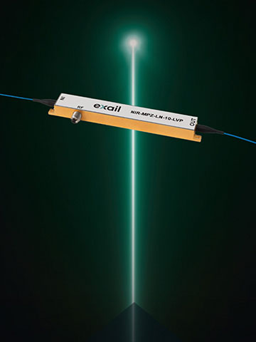 A device suspended in front of a green laser beam