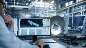 Person looking at a satellite on a computer screen