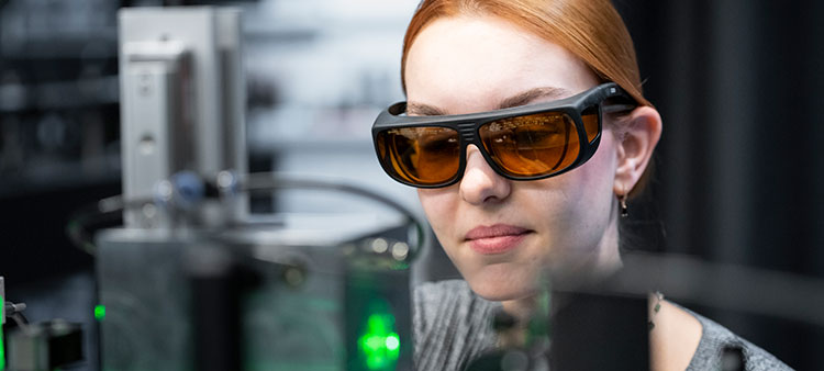 Lasers Charge and Trap Micrometer-Sized Particles