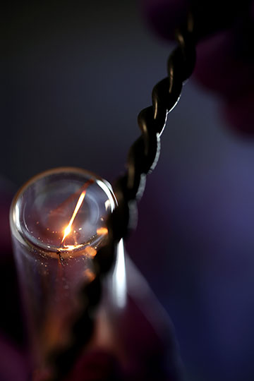 Bulb with light and a twisted filament