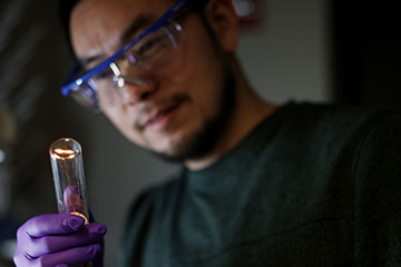 Man holding up a bulb